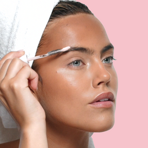 SWATI Cosmetics model applying Tourmaline on eyebrows.